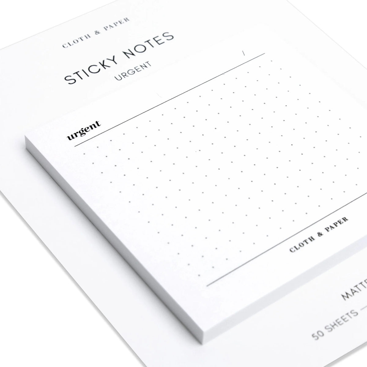 Cloth & Paper White sticky notes with 'urgent' text and grid pattern on a white background