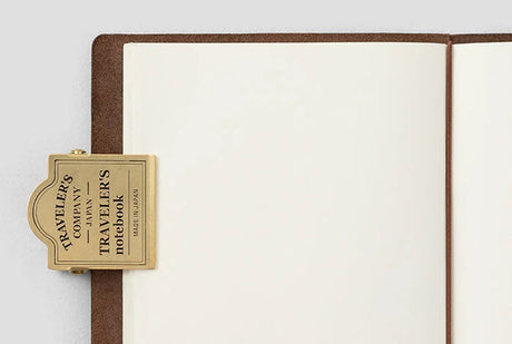 TRAVELER'S Company Brass Notebook Clip Shown on Notebook