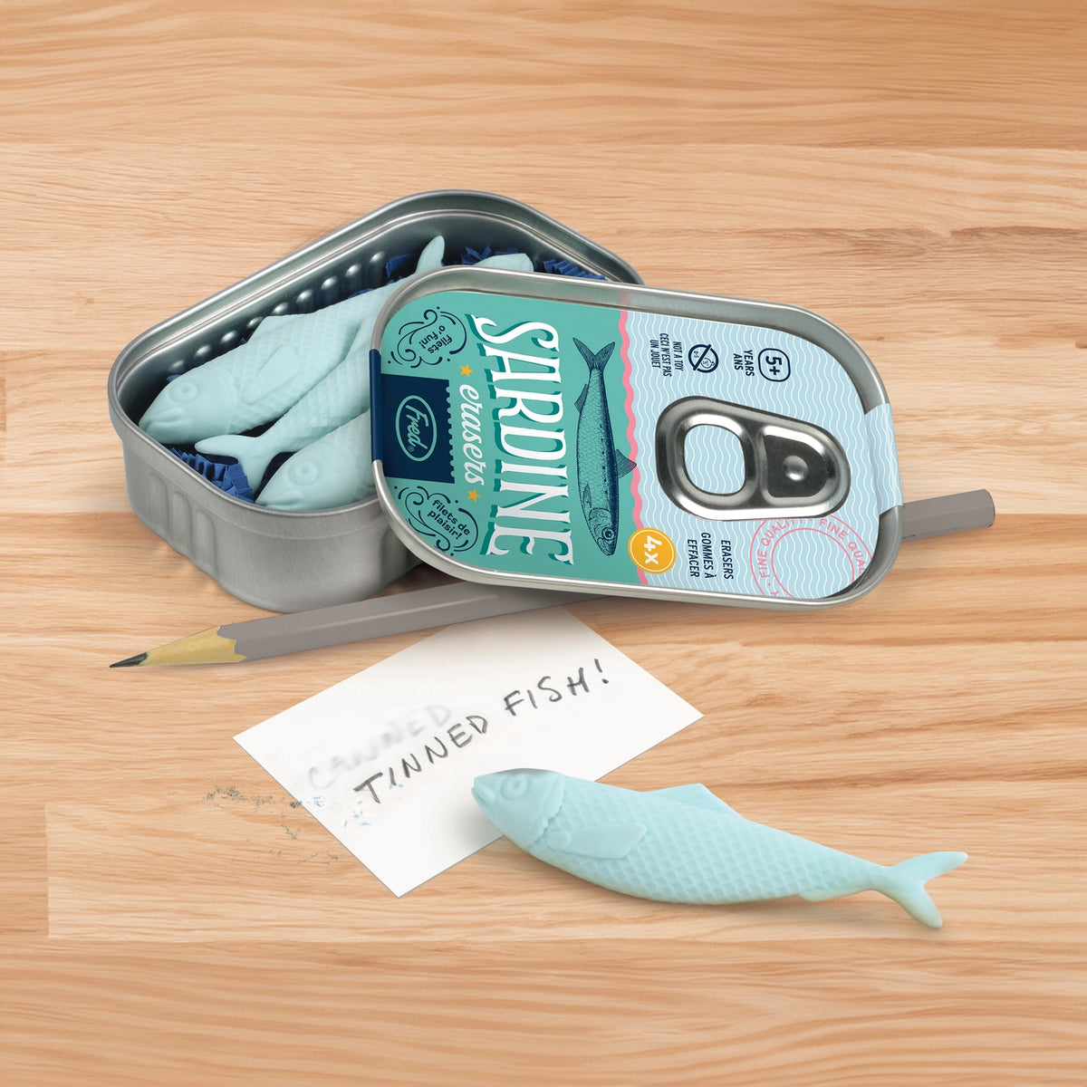 Fred & Friends Sardine Erasers in Tin showing writing sample with eraser sample