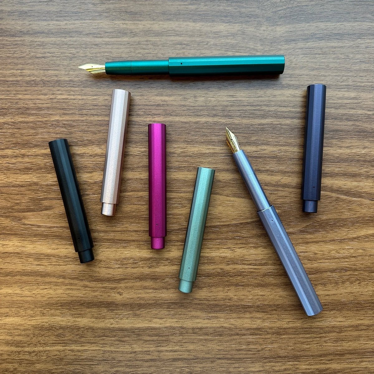 Tom's Studio Studio Pocket Fountain Pens uncapped and capped on desk