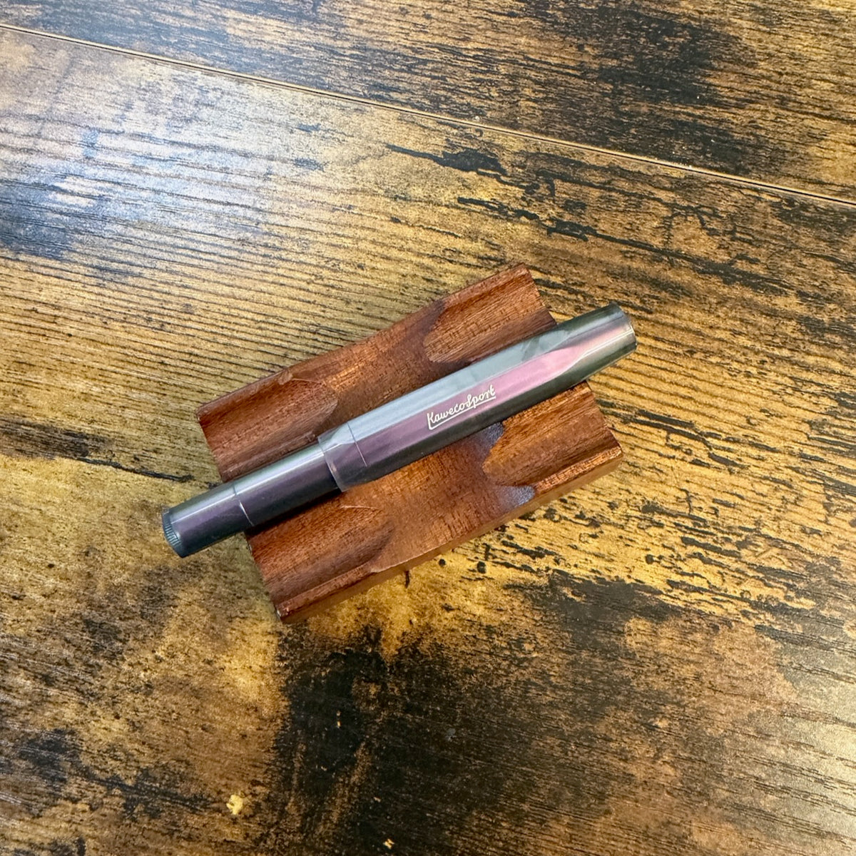 Kaweco Lunar Sport Rollerball in Shadow Purple Capped on Pen Stand