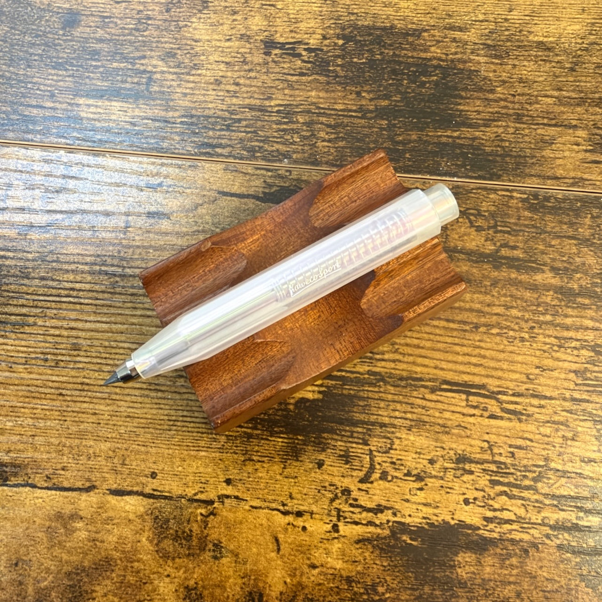Kaweco Lunar Sport Clutch Pencil in lunar light purple acrylic on pen stand