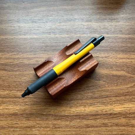 Uni Kuru Toga Alpha Gel Switch Mechanical Pencil in yellow with black trim and gel grip.