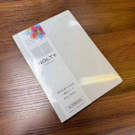 NOLTY A5 Notebook with light gray cover and grid layout.