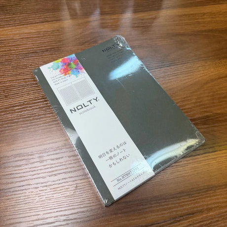 NOLTY A5 Notebook with khaki cover and grid layout.