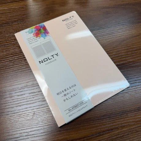 NOLTY A5 Notebook with pale pink cover and grid ayout.
