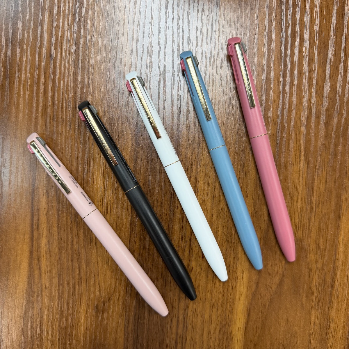 Anterique Stationers 3-Color Multi-Pens arrayed on Table