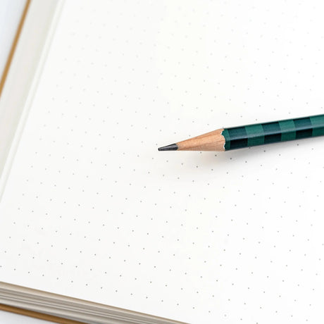 Blackwing Bill Russell Volume 11 Notebook with Sharpened Pencil over Open Page