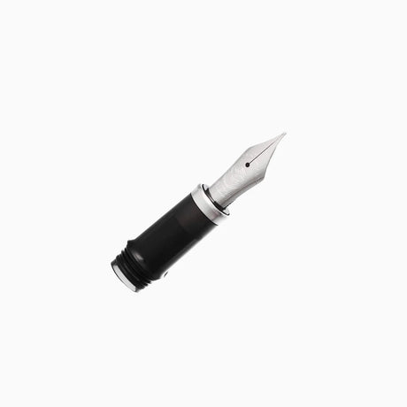A close-up of a TWSBI Vac700R fountain pen nib and part of the black grip on a plain white background.