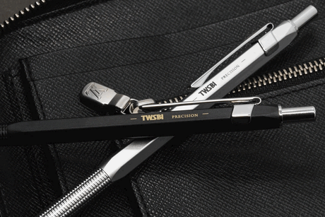 TWSBI Precision Ballpoint Pen in Black and Silver atop Denim fabric