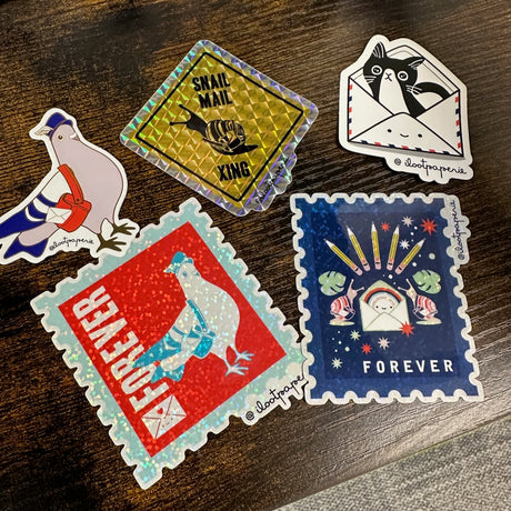 ILootPaperie Stickers on a Desk Showing Snail Mail Themes