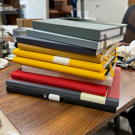 A Full Stack of A5 Notebooks on Desk