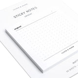 Cloth & Paper White sticky notes with 'urgent' text and grid pattern on a white background