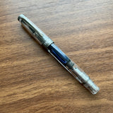 TWSBI Diamond 580 ALR Nickel Fountain Pen Inked on Table