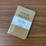 A set of three Field Notes 48 page pocket notebooks with kraft paper covers, ruled.