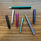 Tom's Studio Studio Pocket Fountain Pens uncapped and capped on desk