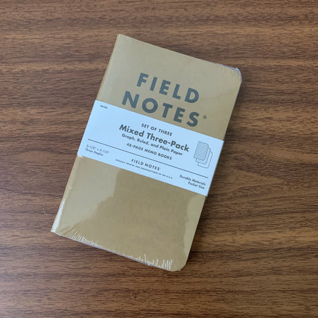 A set of three Field Notes 48 page pocket notebooks with kraft paper covers, Mixed Three-Pack with Graph, Ruled, and Plain rulings.