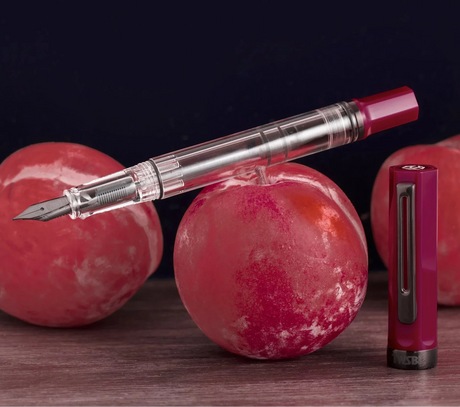 TWSBI ECO Plum + Onyx Fountain Pen Balanced on Plum
