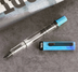 TWSBI Cosmo Blue + Onyx Fountain Pen on Gray Background