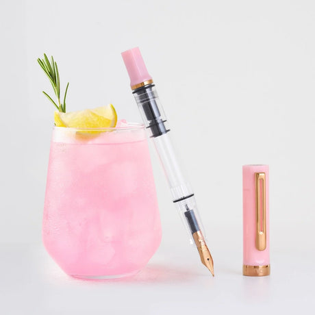 TWSBI ECO Pink Lemonade Uncapped Next to Drink