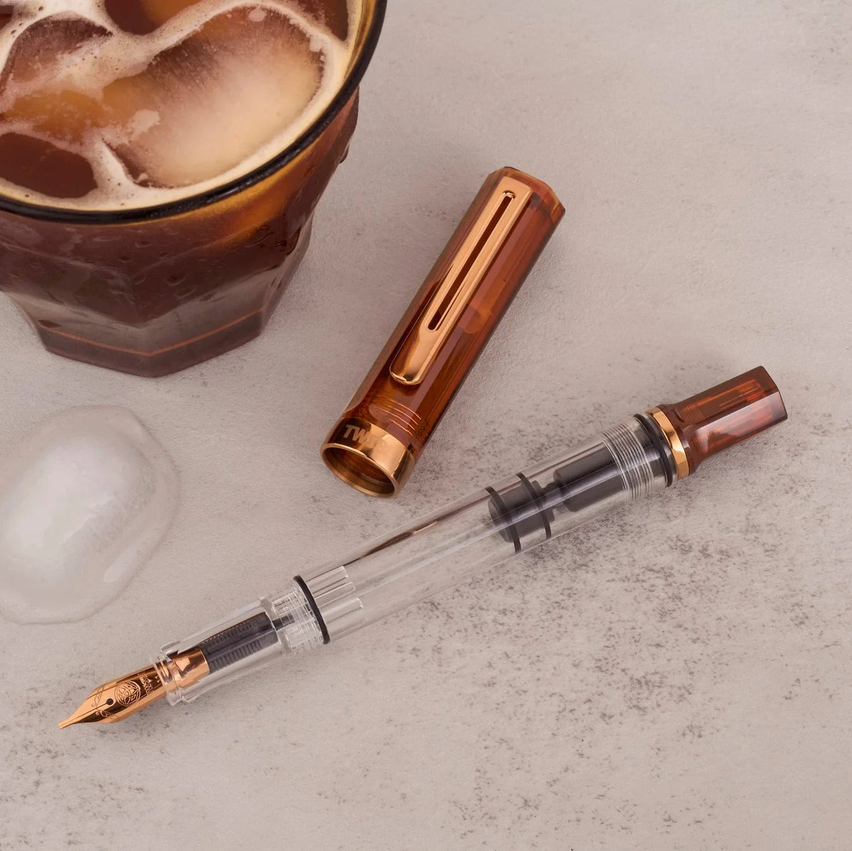 TWSBI ECO Rootbeer + Bronze Fountain Pen Uncapped on Desk