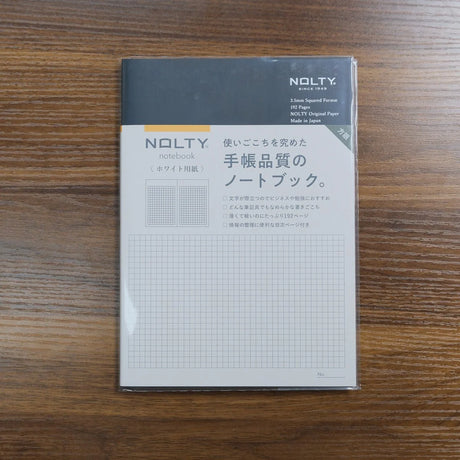 NOLTY A5 Notebook with black cover and 192 white 3.5mm grid pages.