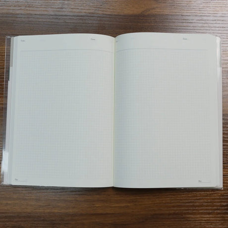 Open NOLTY A5 Notebook with white grid pages and headers for title and date.