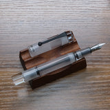 Opus 88 Clear Demonstrator Fountain Pen Uncapped on Pen Stand