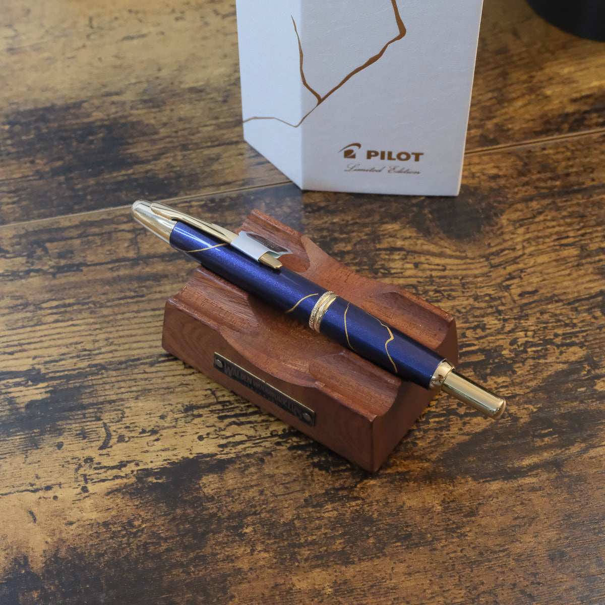 Pilot Limited Edition Golden Journey Fountain Pen featuring Dark Blue Lacquer with Kintsugi detailing, shown here on pen stand