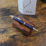 Pilot Limited Edition Golden Journey Fountain Pen featuring Dark Blue Lacquer with Kintsugi detailing, shown here on pen stand