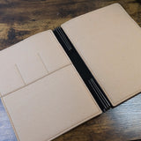 Roterfaden Taschenbegleiter LTD_038 A4 Portfolio in Brown Leather with Sand Felt Interior open on desk