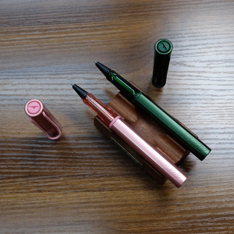 Lamy AL-Star Pine and Flamingo Rollerball Pens Uncapped