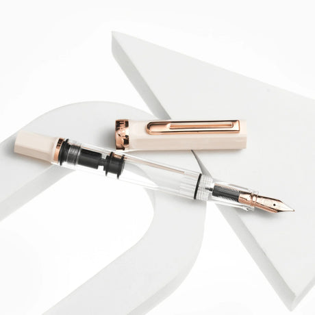 TWSBI ECO Creme and Rose Gold Fountain Pen Stock Image Uncapped