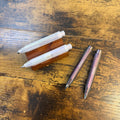 Kaweco Lunar Sport Mechanical Pencils in Shadow Purple and Light Purple in two different lead sizes fanned on desk