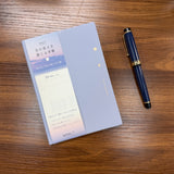 Midori B6 Gradation Day Length Planner in Purple with Pen shown for scale