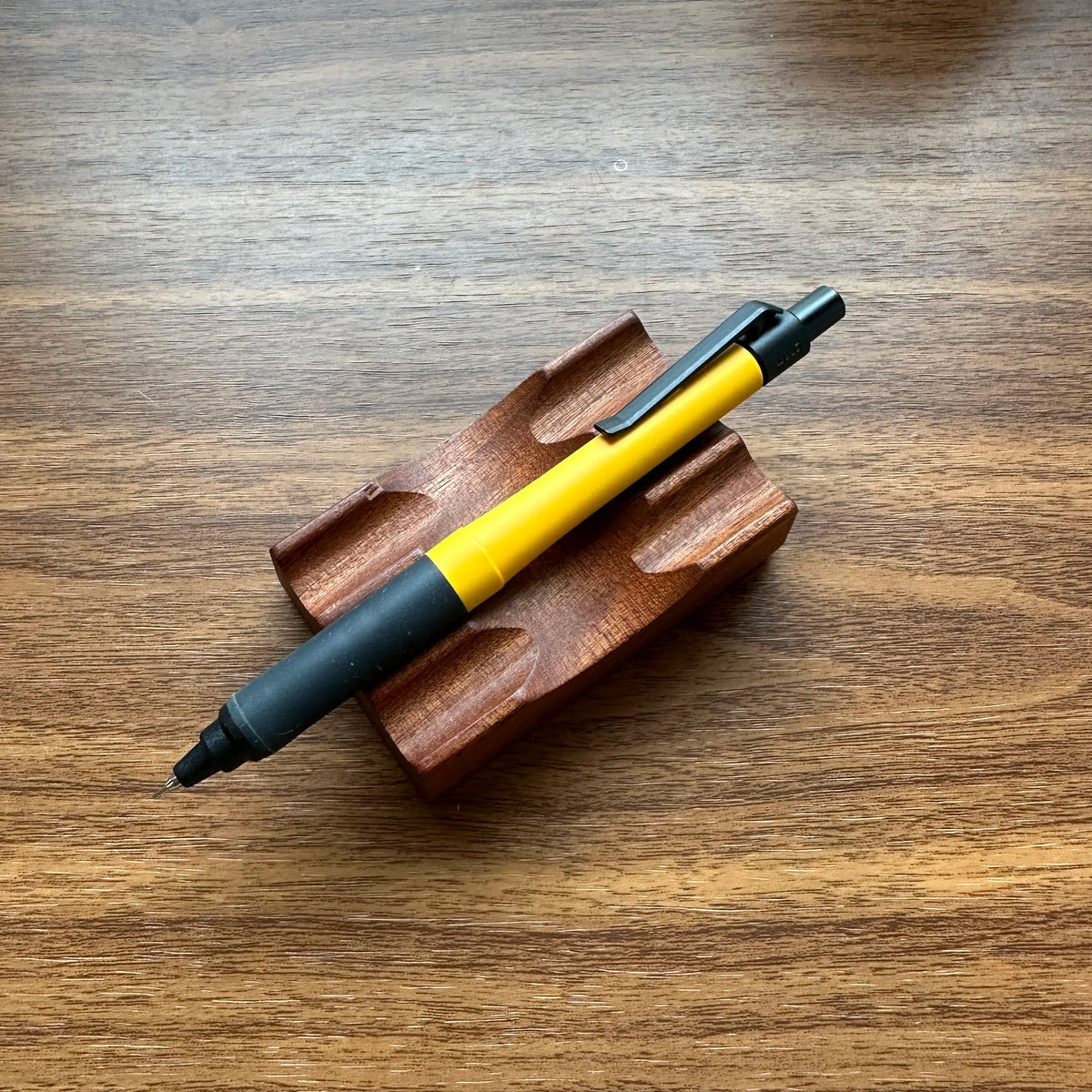 Uni Kuru Toga Alpha Gel Switch Mechanical Pencil in yellow with black trim and gel grip.