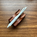 Uni Kuru Toga Alpha Gel Switch Mechanical Pencil in light gray with clear gel grip.