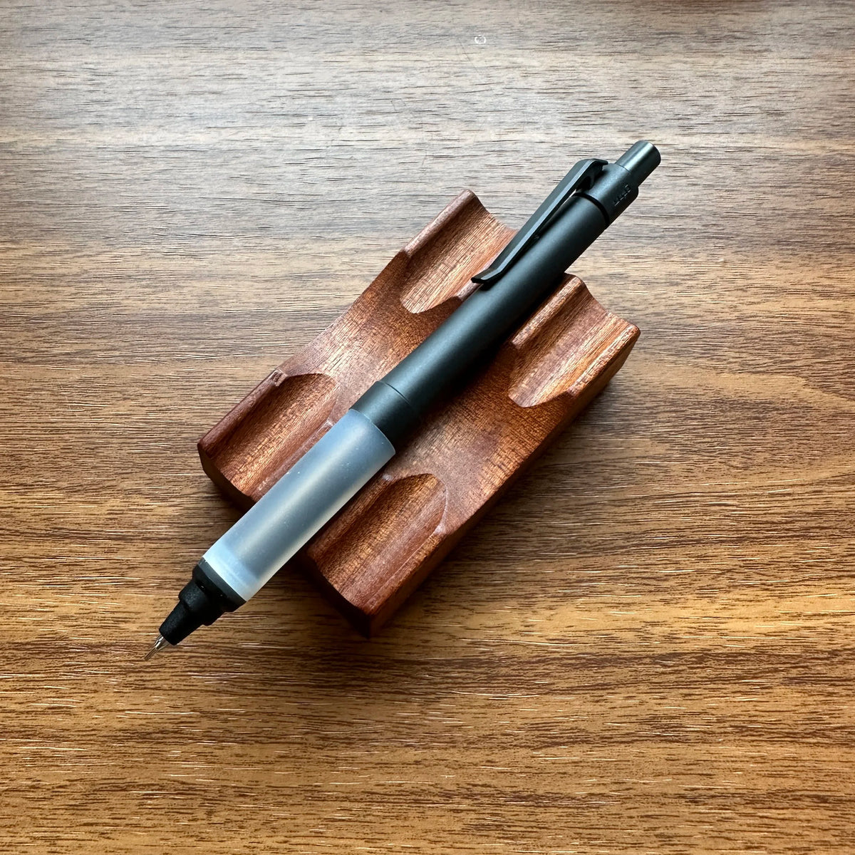 Uni Kuru Toga Alpha Gel Switch Mechanical Pencil in all black with clear gel grip.