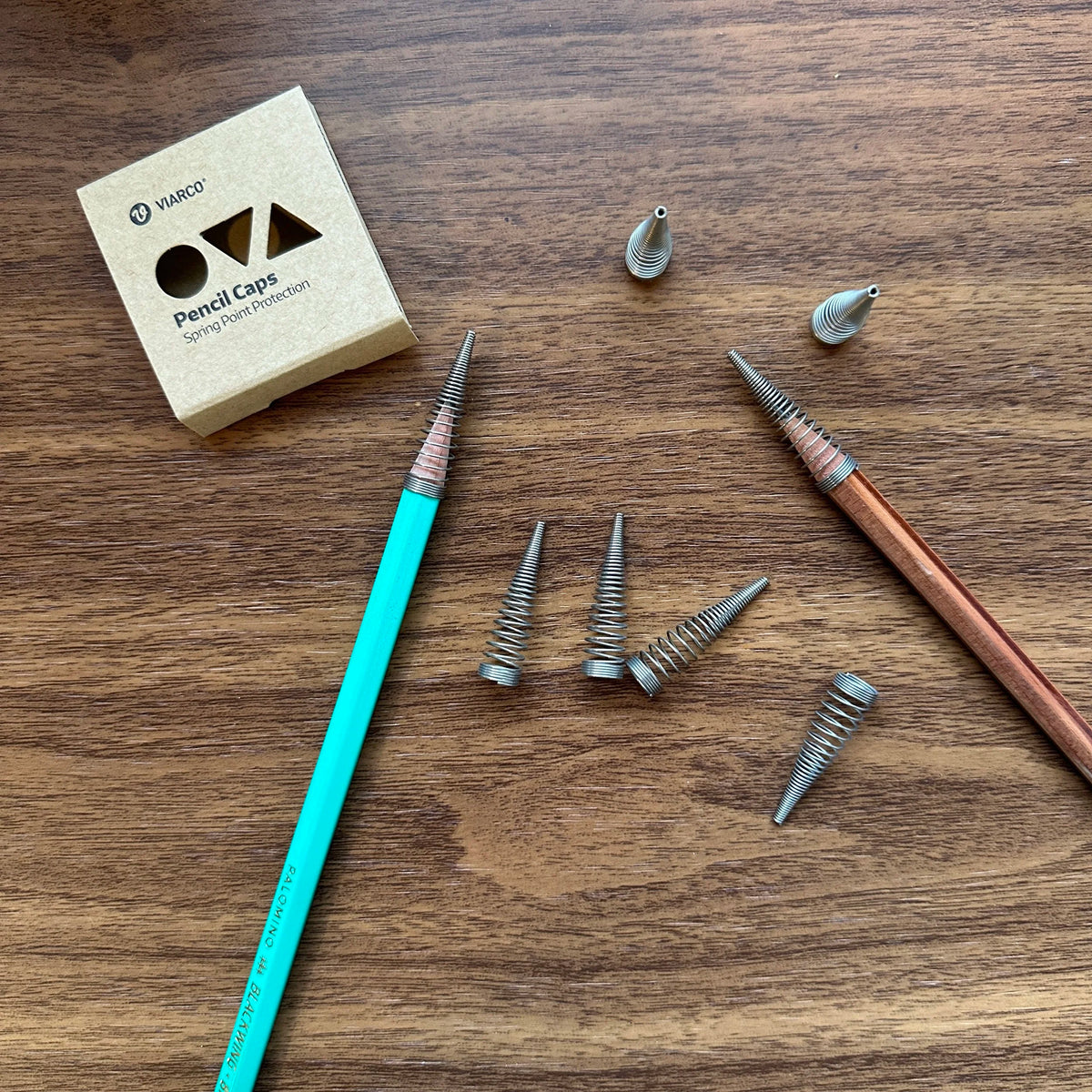 Viarco Spring Pencil Caps with Pencil on Table