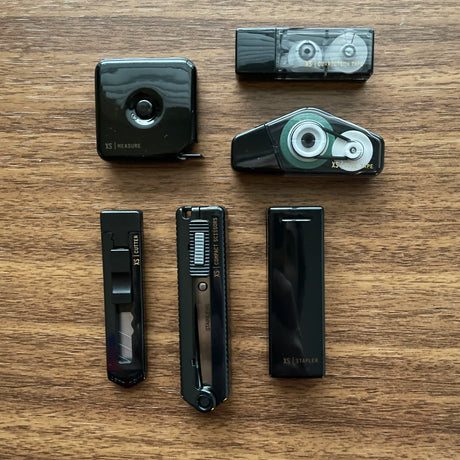 Midori XS Stationery Kit Black Components on table