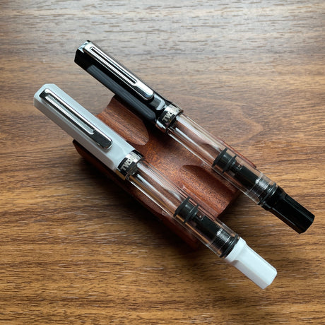 Two TWSBI ECO Fountain Pens Black and White Side-by-side