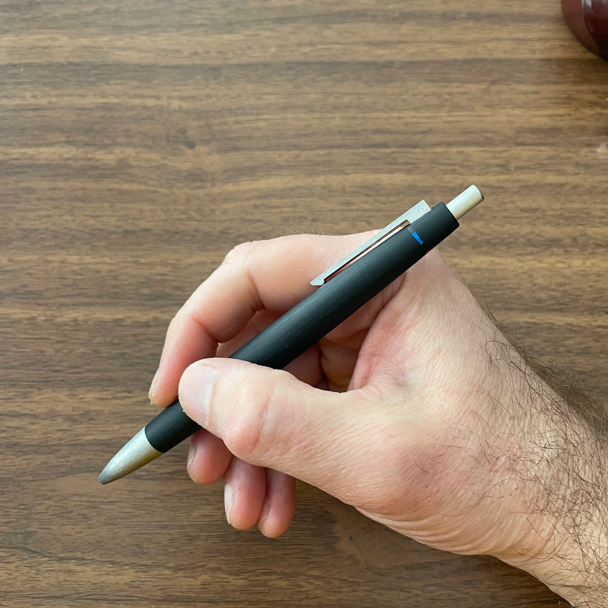 Lamy 2000 4-Color Ballpoint In Hand with Knock Extended