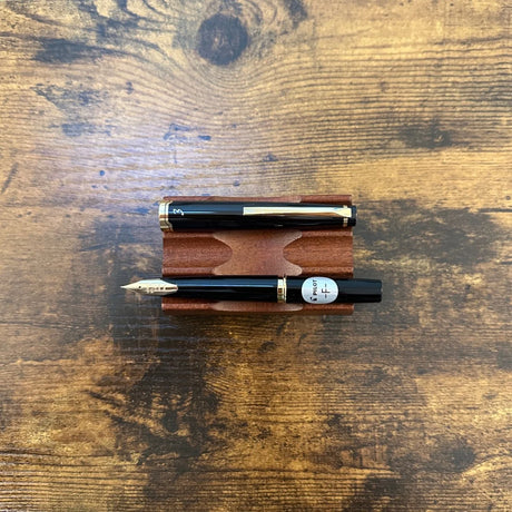 Pilot E95S Fountain Pens Black Uncapped Horizontal on Pen Stand
