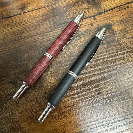 Pilot Capless Vanishing Point Birchwood Red and Black Fountain Pens on Table