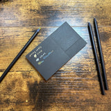 Craft Design Technology Black Pencil Set Three rainbow pencils with writing sample on Black paper (sold separately)