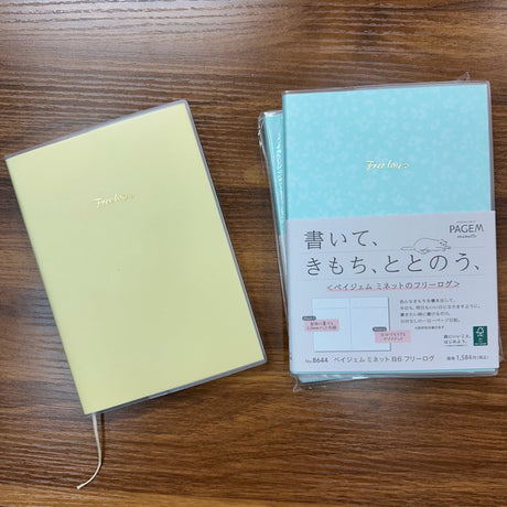 NOLTY PageM Free Log B6 notebooks in yellow and blue with translucent vinyl notebook cover and ribbon bookmark.