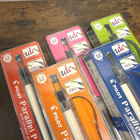 Pilot Parallel Calligraphy Pens arrayed on desk (Cover Image)