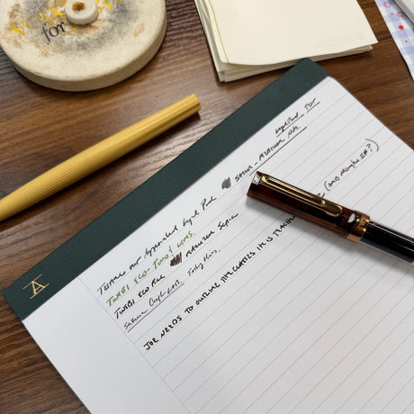 Writing samples on an Appointed Legal Pad with hunter green bookcloth binding and white lined paper.