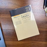 NOLTY A5 Notebook with black cover and 96 ivory grid pages.