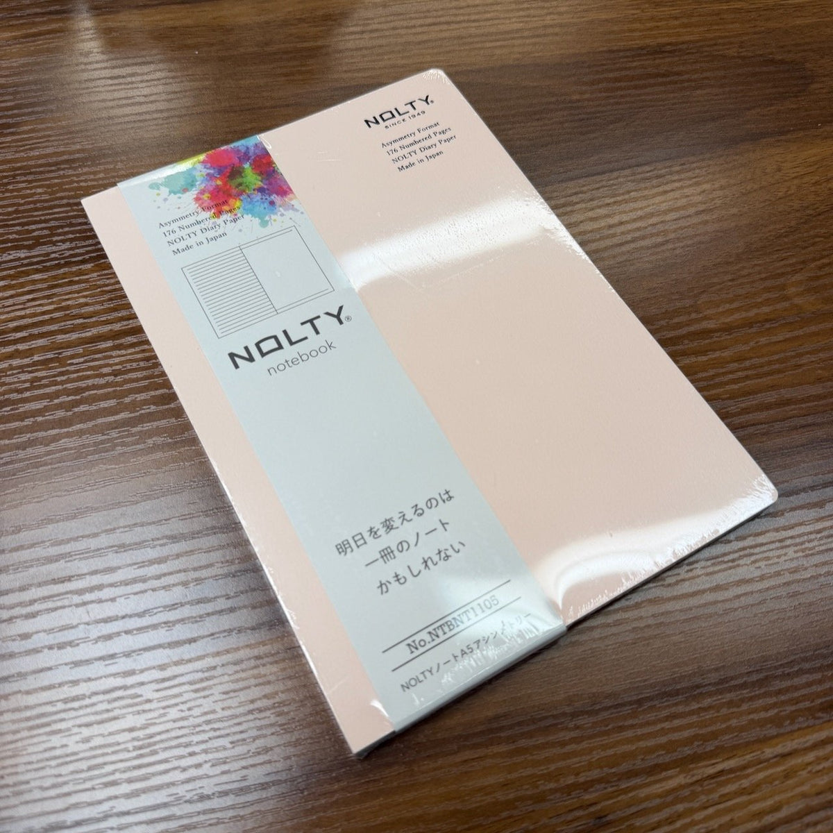 NOLTY A5 Notebook with pale pink cover and asymmetry (lined on left page, dot grid on right page) layout.